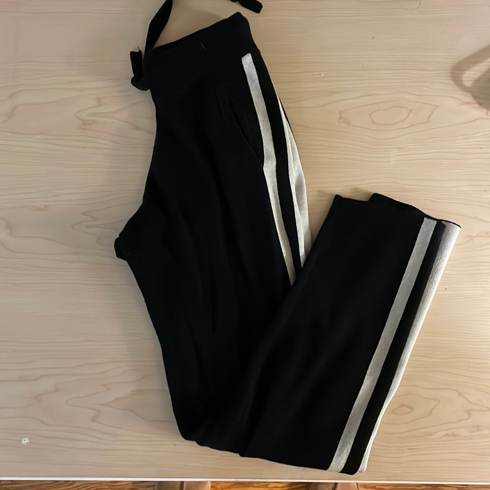 black joggers with white stripes down the side